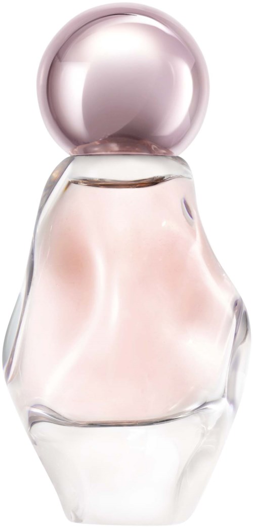 A perfume bottle with a round pink cap and a transparent, slightly pink-tinted glass body.