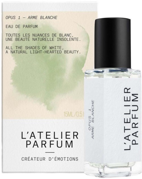 A perfume bottle and a box with white and green colors, describing a light, natural white scent.