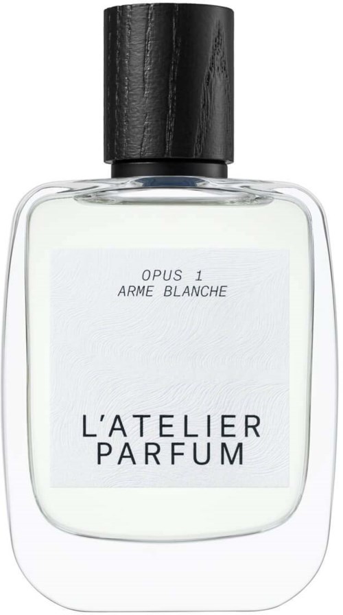 A perfume bottle with a black cap and a simple white label showing the brand 'L'Atelier Parfum' and scent name.