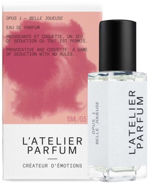 A perfume bottle with black cap and pink box featuring perfume description in French and English.