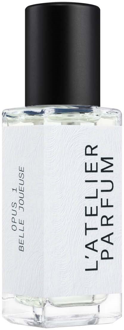 A perfume bottle with a black cap, clear glass, and a white label that reads "L'Atelier Parfumeur".