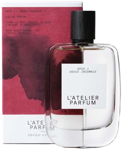 A perfume bottle and box with pink and black colors, featuring French and English text, and a minimalist design.