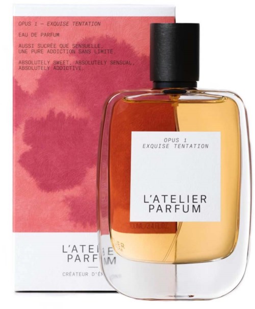 A perfume bottle with a black cap, placed in front of a pink and red box with text describing scent qualities.