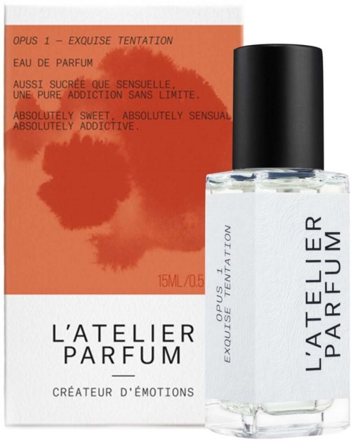 A perfume bottle and box with orange and white colors, labeled "L'Atelier Parfum" and describing it as sweet and addictive.