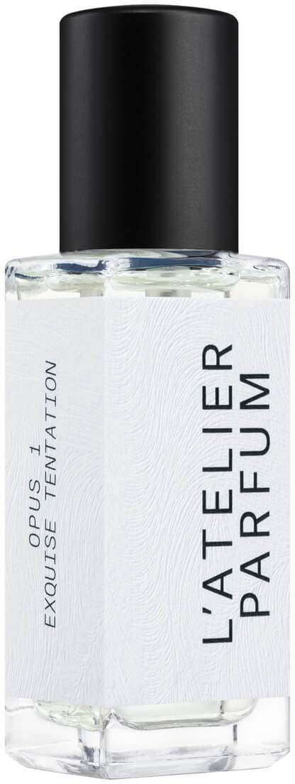 A clear perfume bottle with a black cap and a white label reading 'L'ATELIER PARFUM' and 'EXQUISITE-ENTATION.'