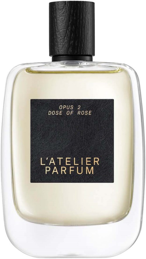 A perfume bottle with a black cap, clear glass, and a black label, labeled 'L'ATELIER PARFUM,' 'OPUS 2,' and 'DOSE OF ROSE.'