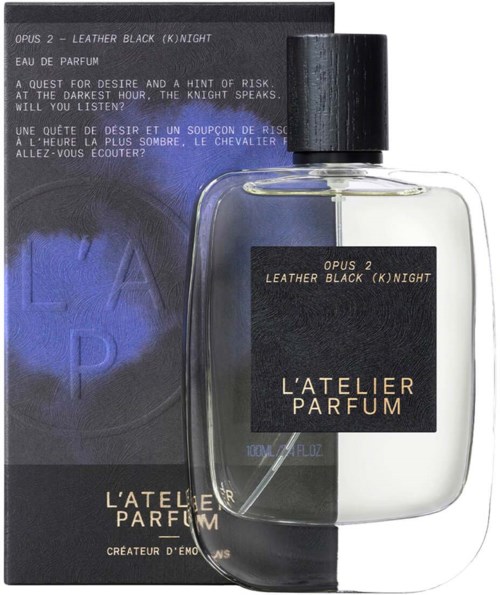 A perfume bottle with black and transparent design, labeled 'LEATHER BLACK (K)NIGHT' by L'ATELIER PARFUM, next to its box.