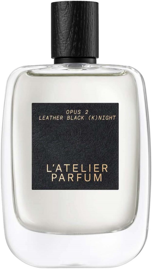 A perfume bottle with a black cap, clear glass, and a black label showing the brand La'Telier Parfum.