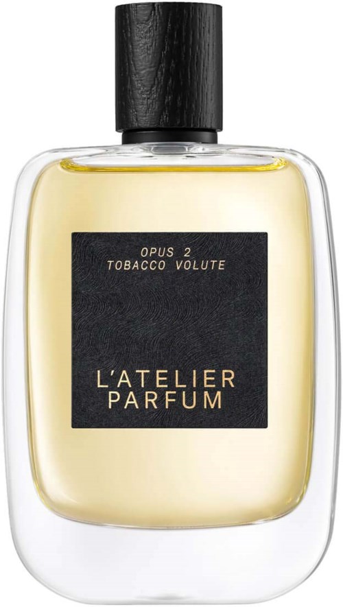 A perfume bottle with a black cap, yellow liquid inside, and a black label with gold text.