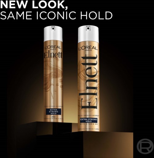 Två L'Oreal Elnett hårsprayburkar, visar ny design med samma ikoniska håll, mot en mörk bakgrund.