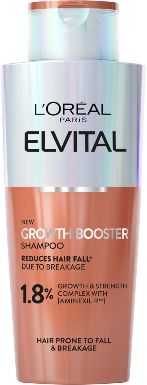 A bottle of Elvital Growth Booster Shampoo, orange and white, claims to reduce hair fall and strengthen hair.
