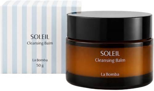 Gulbrun krukke med Soleil Cleansing Balm ved siden av stripete eske.