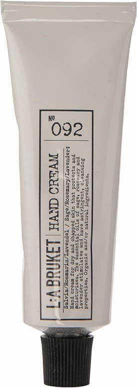 Een tube handcrème met label 'La Bouquet Hand Cream' met zwart deksel en gedetailleerde tekst op de voorkant.