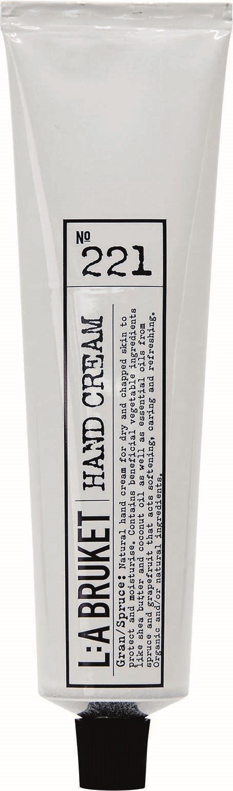 Ein weißer Tubus mit schwarzem Deckel, beschriftet "L.A. BURKET HAND CREAM" und Nummer 221.
