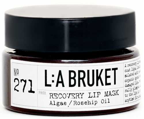 Ein kleiner Behälter mit dem Etikett 'L:A BRUKET' enthält Recovery Lip Mask mit Algen und Hagebuttenöl.