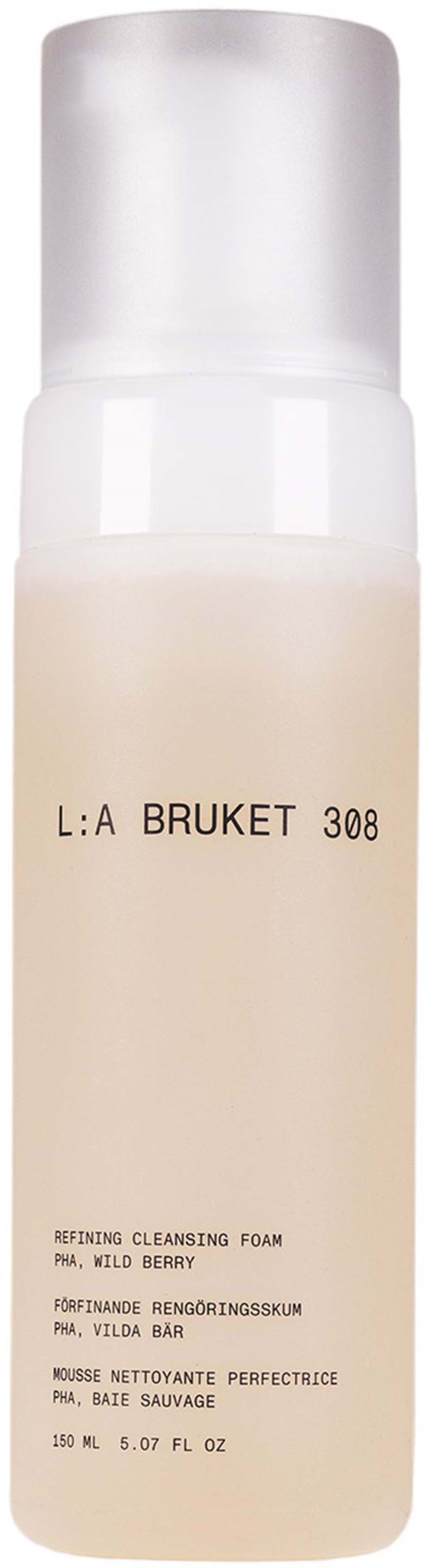Eine weiße Flasche mit einem Etikett, das 'L:A BRUKET 308' und einige Produktdetails liest. Es scheint ein Reiniger oder Schaum zu sein.