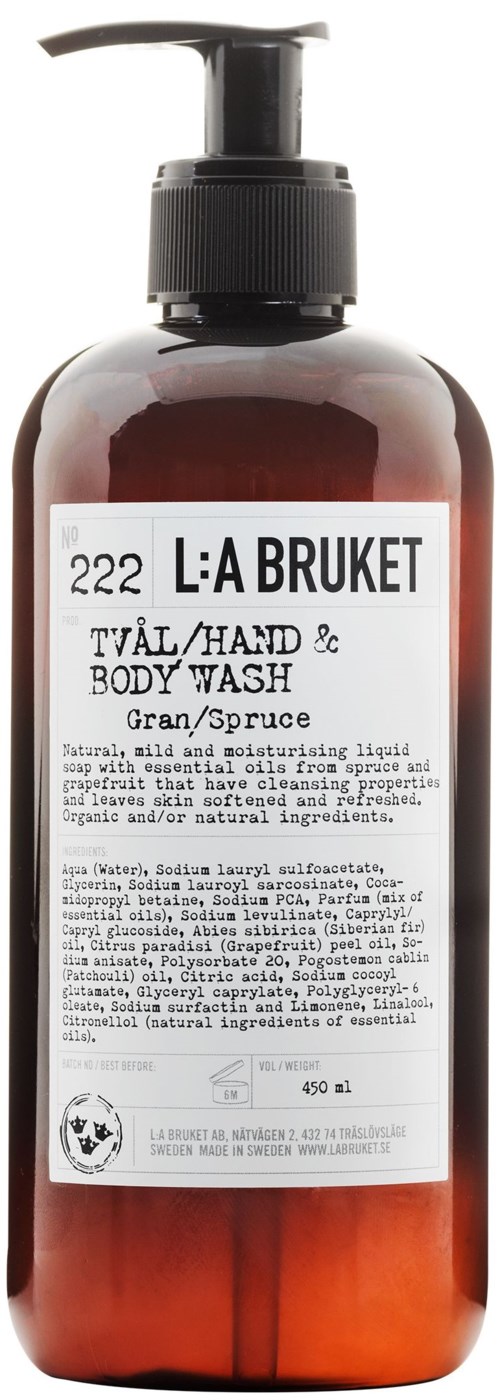 En mørk ravfarget væske med svart pumpe. Etiketten viser at det er hånd- og kroppsvask med naturlige ingredienser.