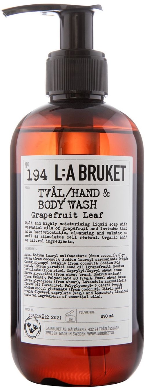 Een bruine fles met pompdispenser met label L:A BRUKET grapefruitblad lichaamswas. 250 ml.