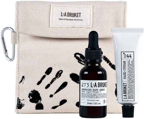 Ein Hautpflege-Set mit Tasche, Serumflasche mit Tropfer und Creme-Tube, alle mit natürlichen Inhaltsstoffen.