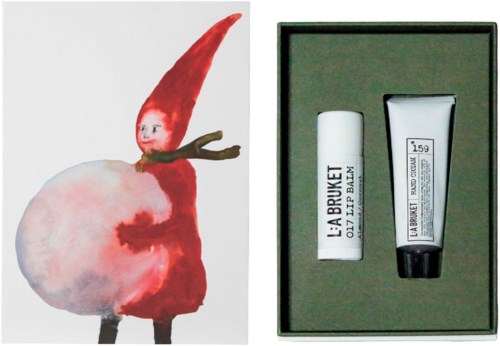 Akvarelli_s depicting a creature with an apricot body and a red pointed head next to skincare gift set with lip balm and hand cream.