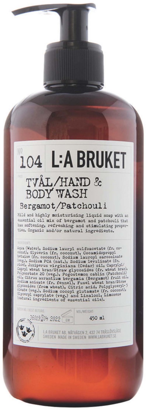 En mørk brun flaske med pumpe, merket med produktnavn og detaljer, brukt for hånd- og kroppsvask.