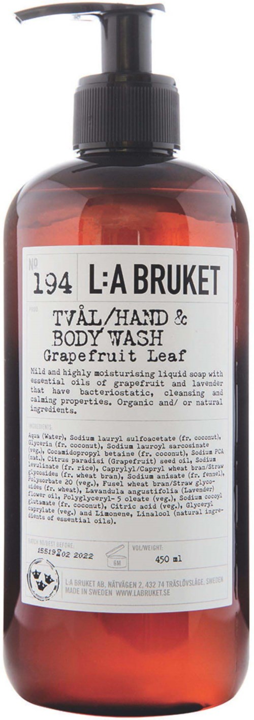 A brown bottle with a pump labeled 'L:A BRUKET' and 'Body Wash' with grapefruit leaf scent.