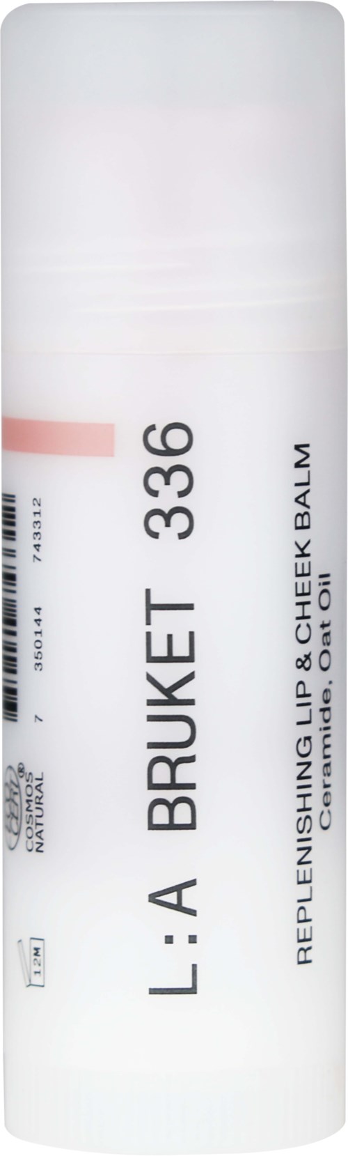 Valkoinen pyöreä putki, jossa musta teksti L:A Bruket, tuotekoodi 336 ja kuvaus Replenishing Lip & Cheek Balm.