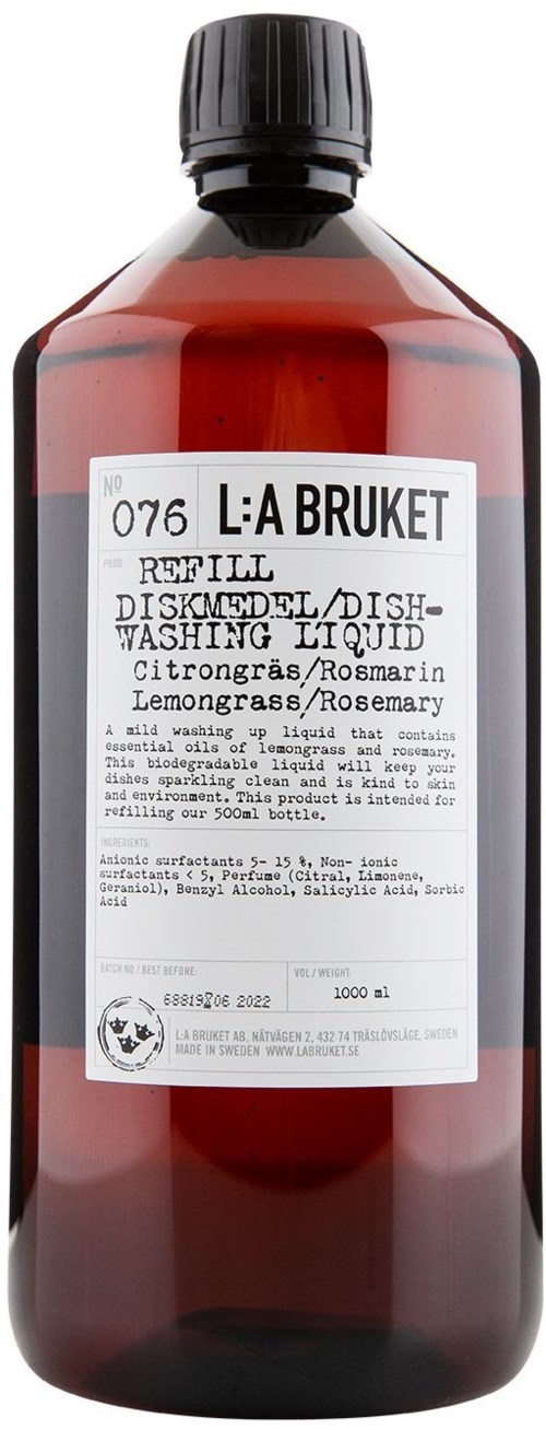 Nachfüllflasche für Spülmittel mit Etikett, zeigt Zitrusgeruch, Rosmarin und Zitronengras.