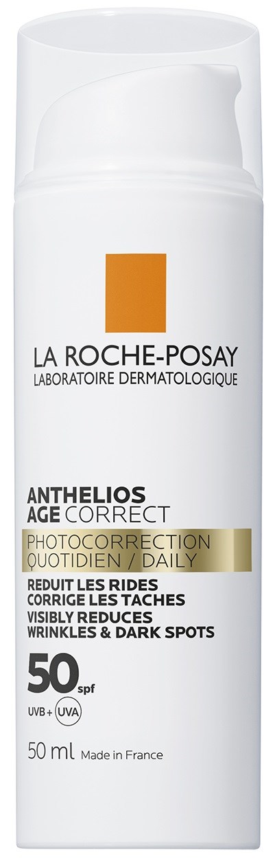 A white bottle of La Roche-Posay sunscreen with pump, labeled for age correction, reducing wrinkles and dark spots, SPF 50.