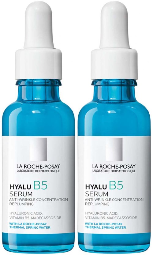 Twee blauwe flessen La Roche-Posay Hyalu B5 serum met witte doppen, bevat hyaluronzuur en vitamine B5.