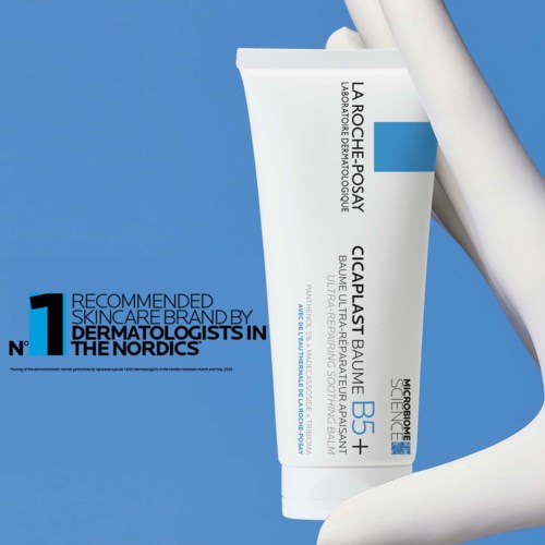 A white tube of La Roche-Posay skincare cream on a blue background with black and blue text.