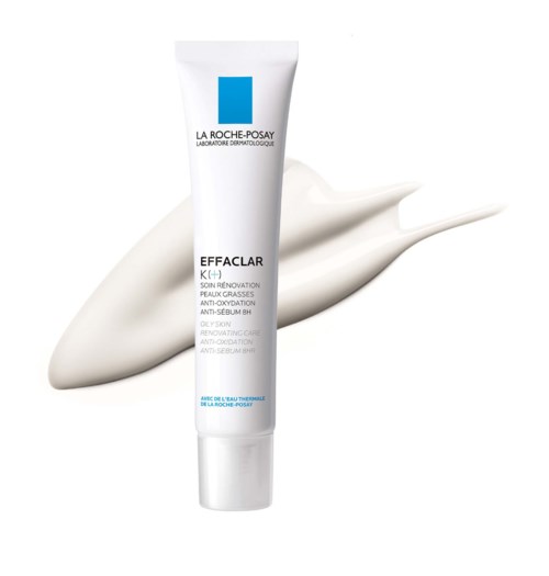 Een witte tube La Roche-Posay Effaclar K+ crème met wat witte crème erachter.