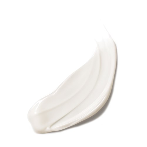 Een witte crème of lotion met een gladde textuur, gesmeerd over een eenvoudige achtergrond.