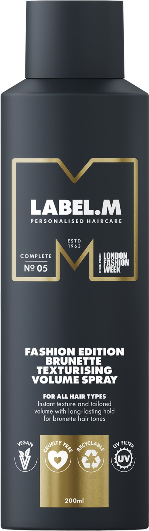 Svart flaska med guld- och vittext, märkt som hårspray för brunetter, volymökning, och passar alla hårtyper.