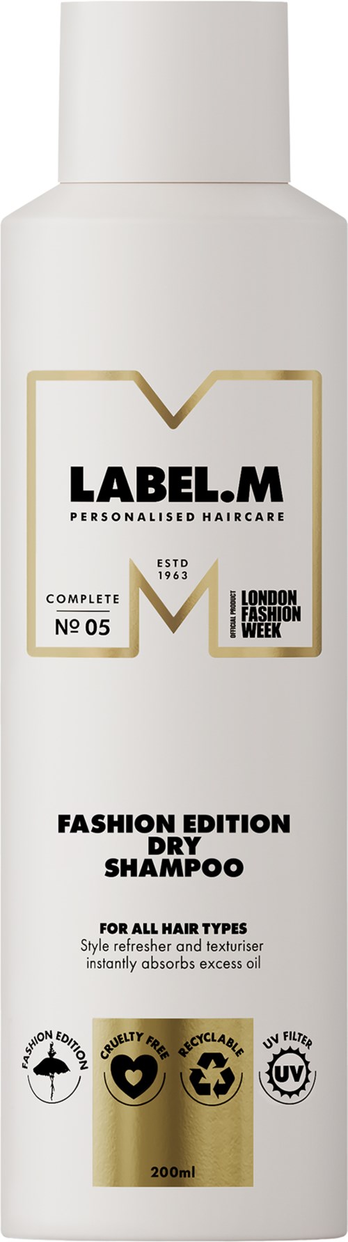 En vit schampoflaska med svart och guldtext, märkt som Fashion Edition Torrschampo för alla hårtyper.