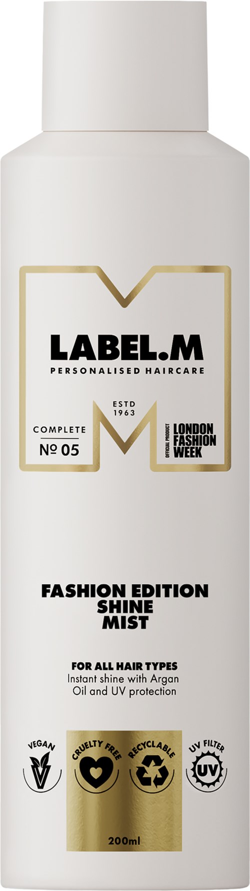 Een witte fles met LABEL.M, haarverzorgingsproduct, met goud en zwarte tekst, voor glans en UV-bescherming.