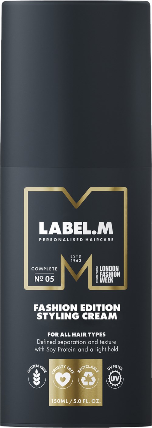 En svart flaska med en etikett som säger 'LABEL.M' och 'Fashion Edition Styling Cream' för alla hårtyper.