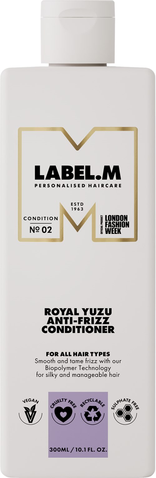 En vit flaska av Label M Royal Yuzu Anti-Frizz Conditioner med en etikett som visar produktinformation och ikoner.