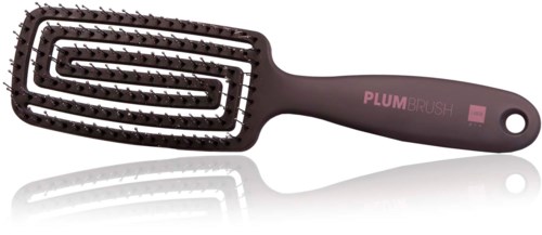 Een zwarte camouflageborstel met kleine spikes en een handvat met de tekst 'PLUMBRUSH'.