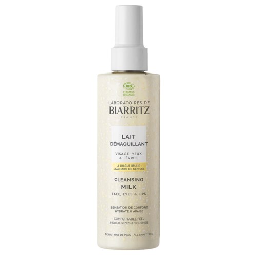 A tall white bottle with a pump. It says Biarritz Cleansing Milk for face, eyes, and lips. Suitable for all skin types.