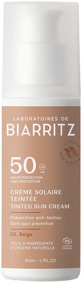 Een fles getinte zonnebrandcrème met SPF 50, beige kleur, bescherming tegen donkere vlekken, bevat natuurlijke ingrediënten, 50 ml.