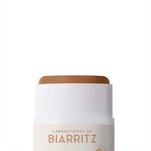 Een witte container met een bruine dop en een label dat zegt "Laboratoires de Biarritz".