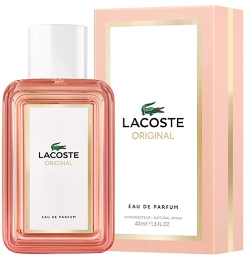 Lacoste Original parfumfles en doos zijn roze met goudaccenten en een groene krokodilloloog.