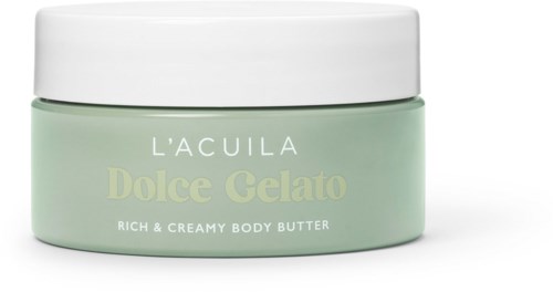 Een pot lichaamsboter met een witte deksel en lichtgroene container, gemarkeerd L'ACULA Dolce Gelato.