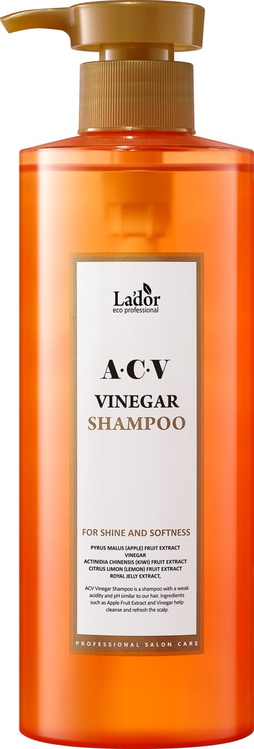 Oranje shampoo fles, gouden pomp, label zegt ACV Azijn Shampoo,Voor glans en zachtheid.