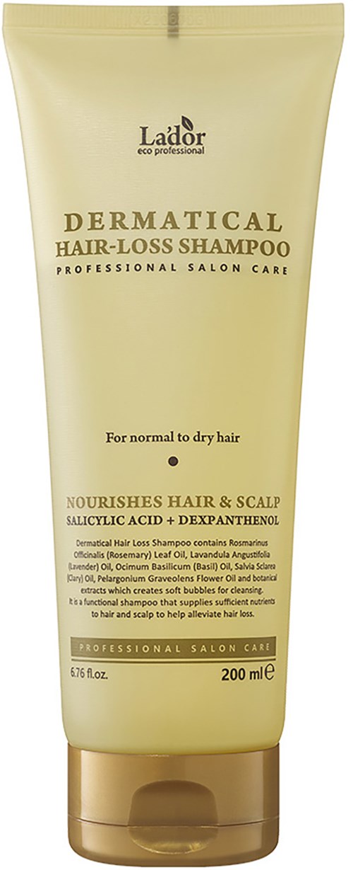 Een beige tube shampoo met gouden dop, aangeduid voor haaruitval en hoofdhuidverzorging, voor normaal tot droog haar.