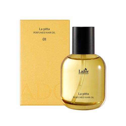 Een doorzichtige gele fles met een zwart deksel naast een gele doos, beide gelabeld La'pitta Perfumd Hair Oil.