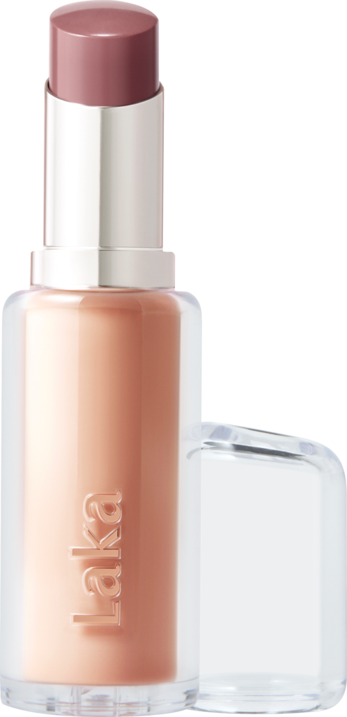 A bottle of liquid foundation with a pinkish shade and a clear cap. The brand name "Laka" is visible.
