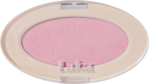 Roze blush in ovaal tasje met beige deksel, gemerkt 'Laka,' glad en glanzend oppervlak.