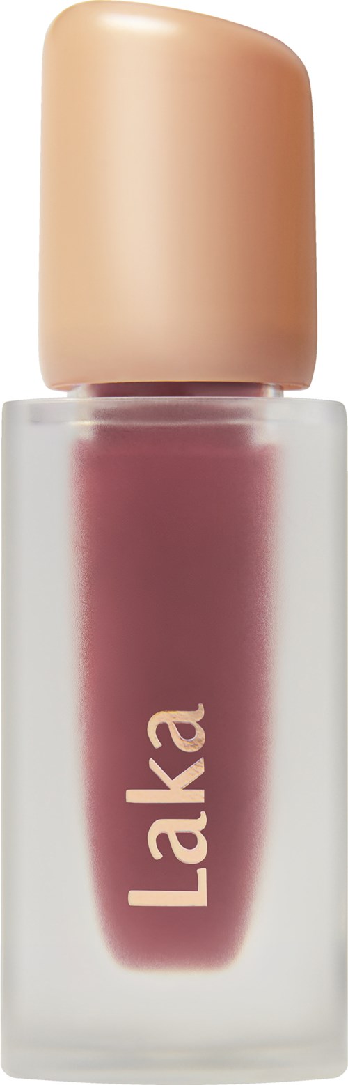 A bottle of pinkish lip gloss or nail polish with a beige cap and the brand name 'Laka' on it.